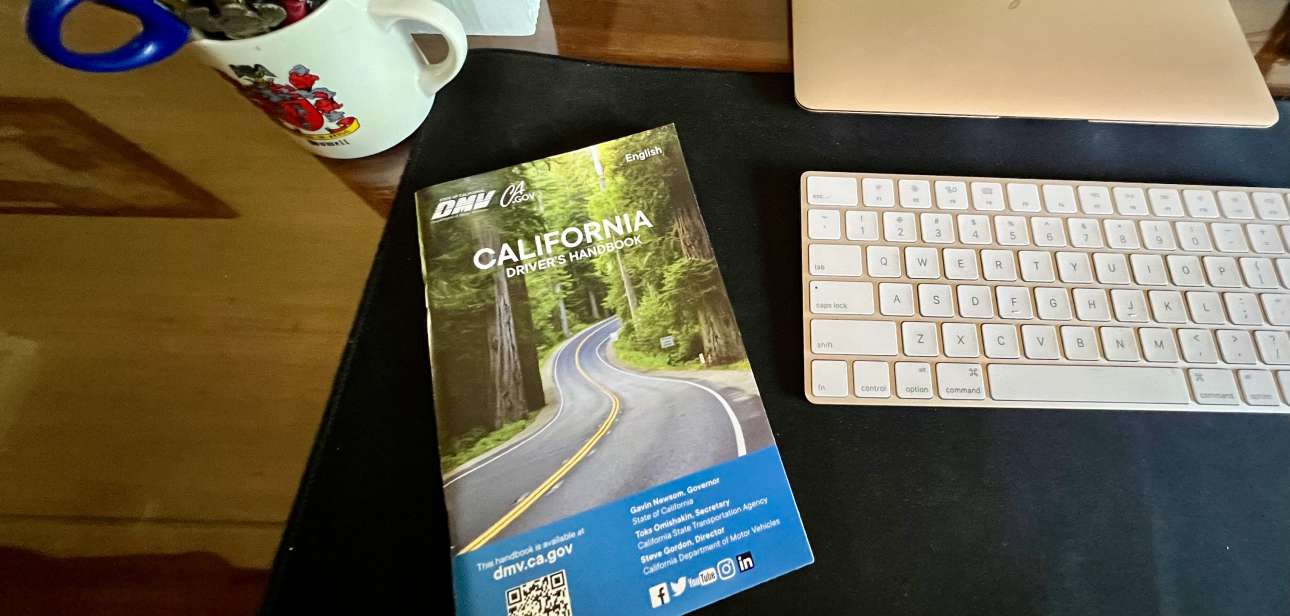 California Driver's Handbook on a desk